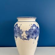 Vintage white and blue ceramic vase with floral pattern