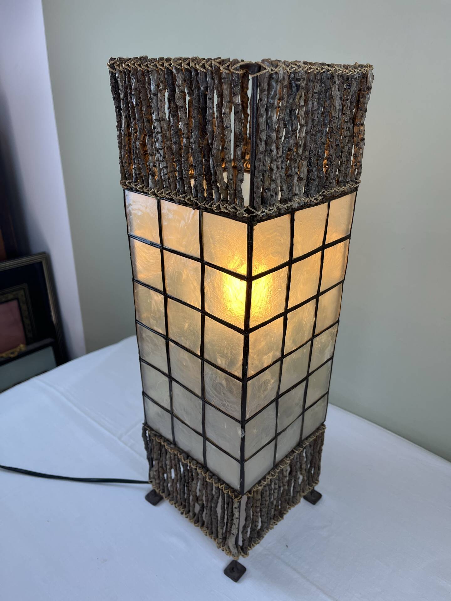 Capiz shell lamp and woven twigs