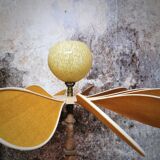 Turned wooden foot lamp and linen and rattan petals