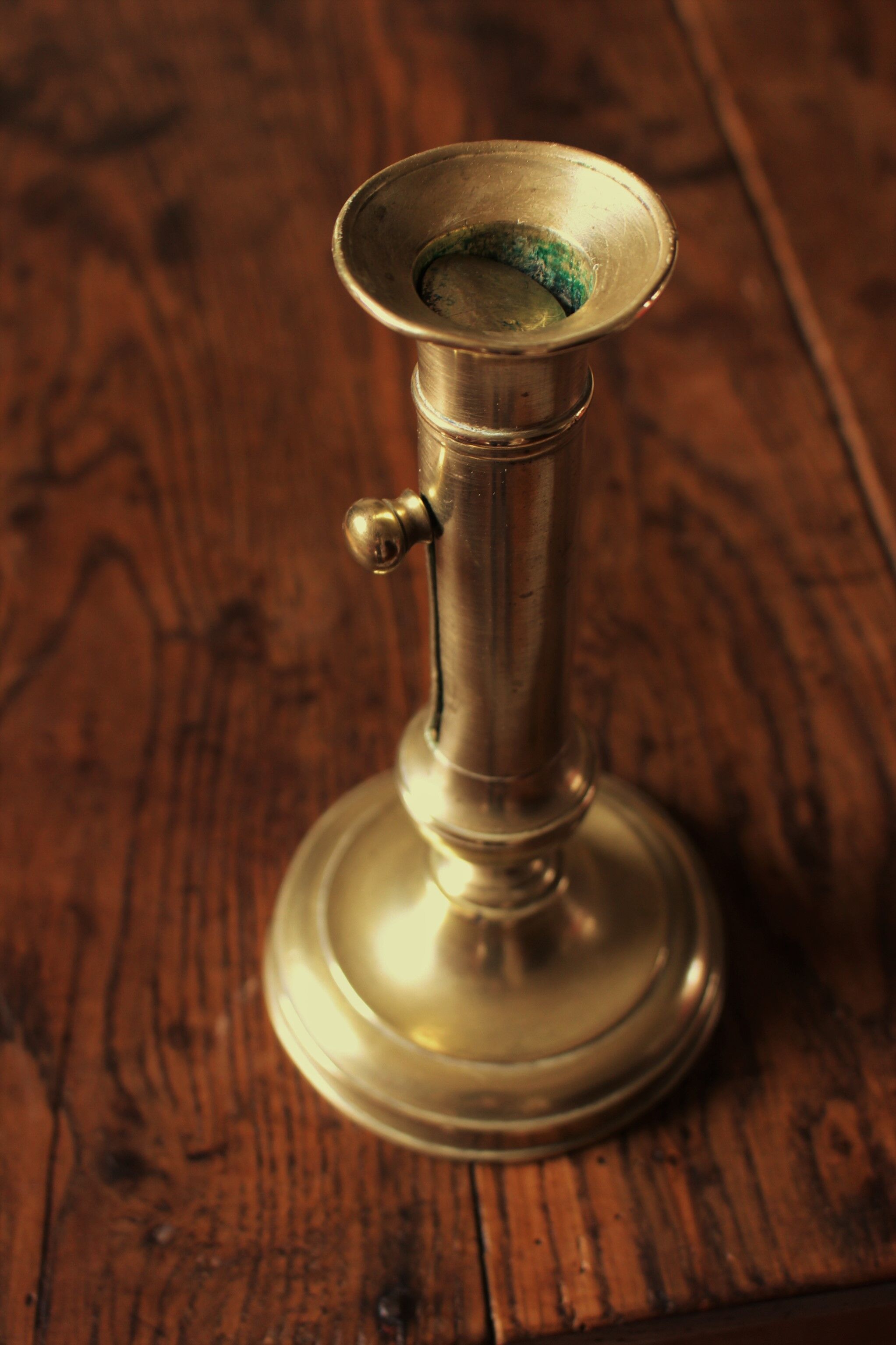 Brass pusher torch candle holder