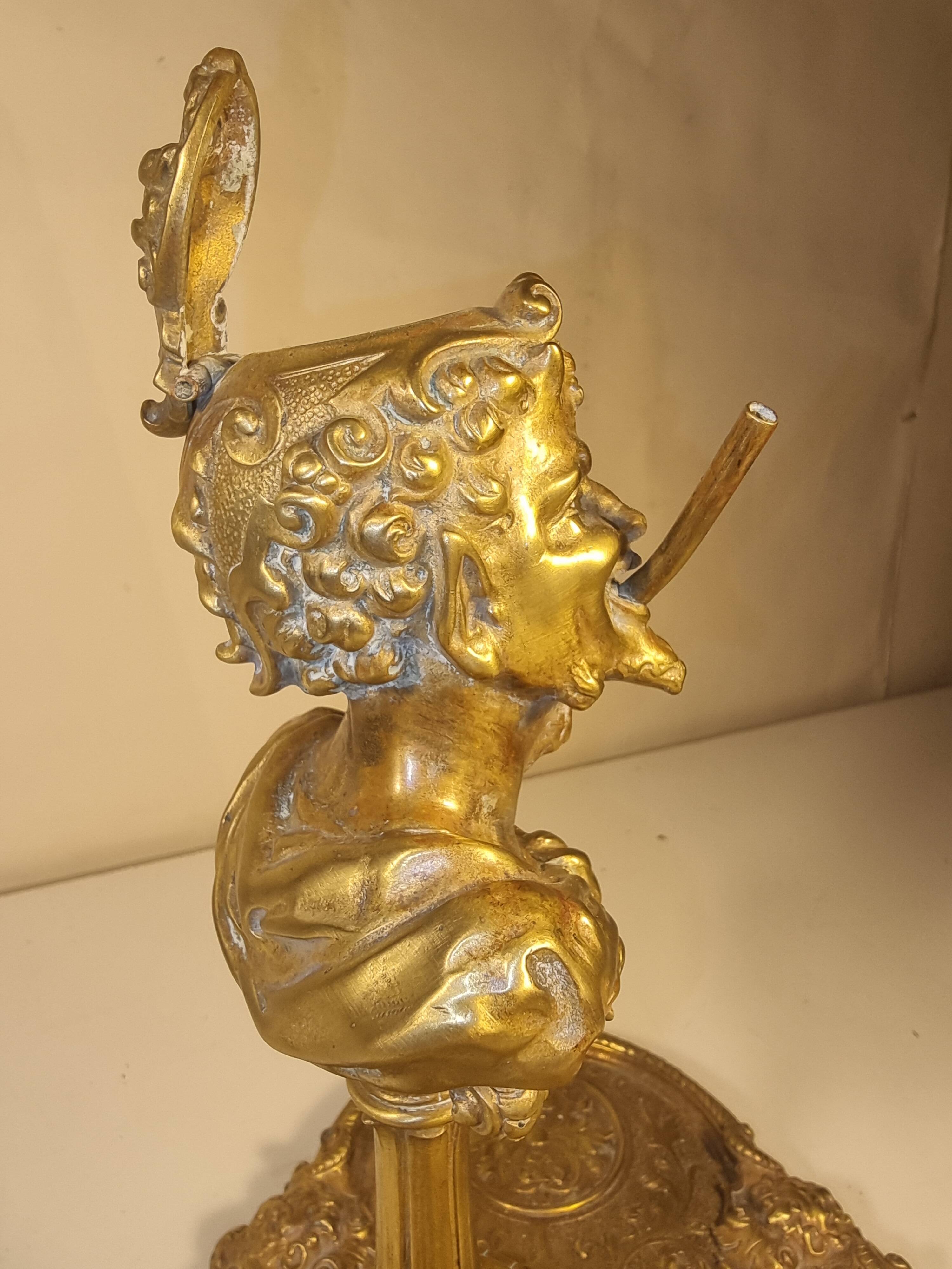 An antique bronze cigar lighter.