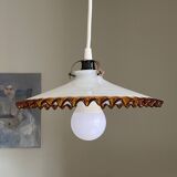 Old pendant light with a white opaline glass shade and a wavy border.