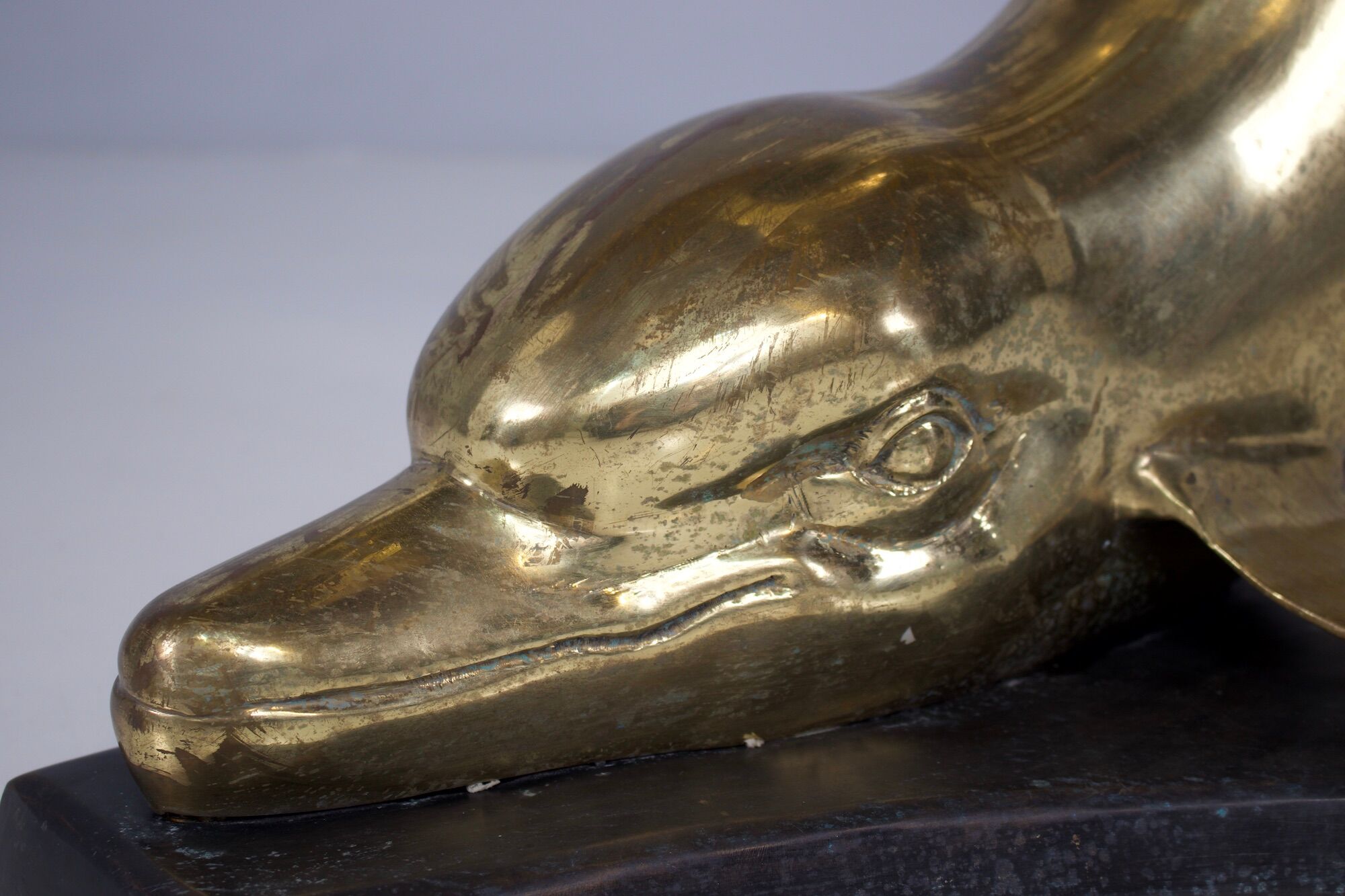 Solid brass dolphin console feet.