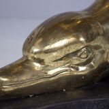 Solid brass dolphin console feet.