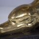 Solid brass dolphin console feet.