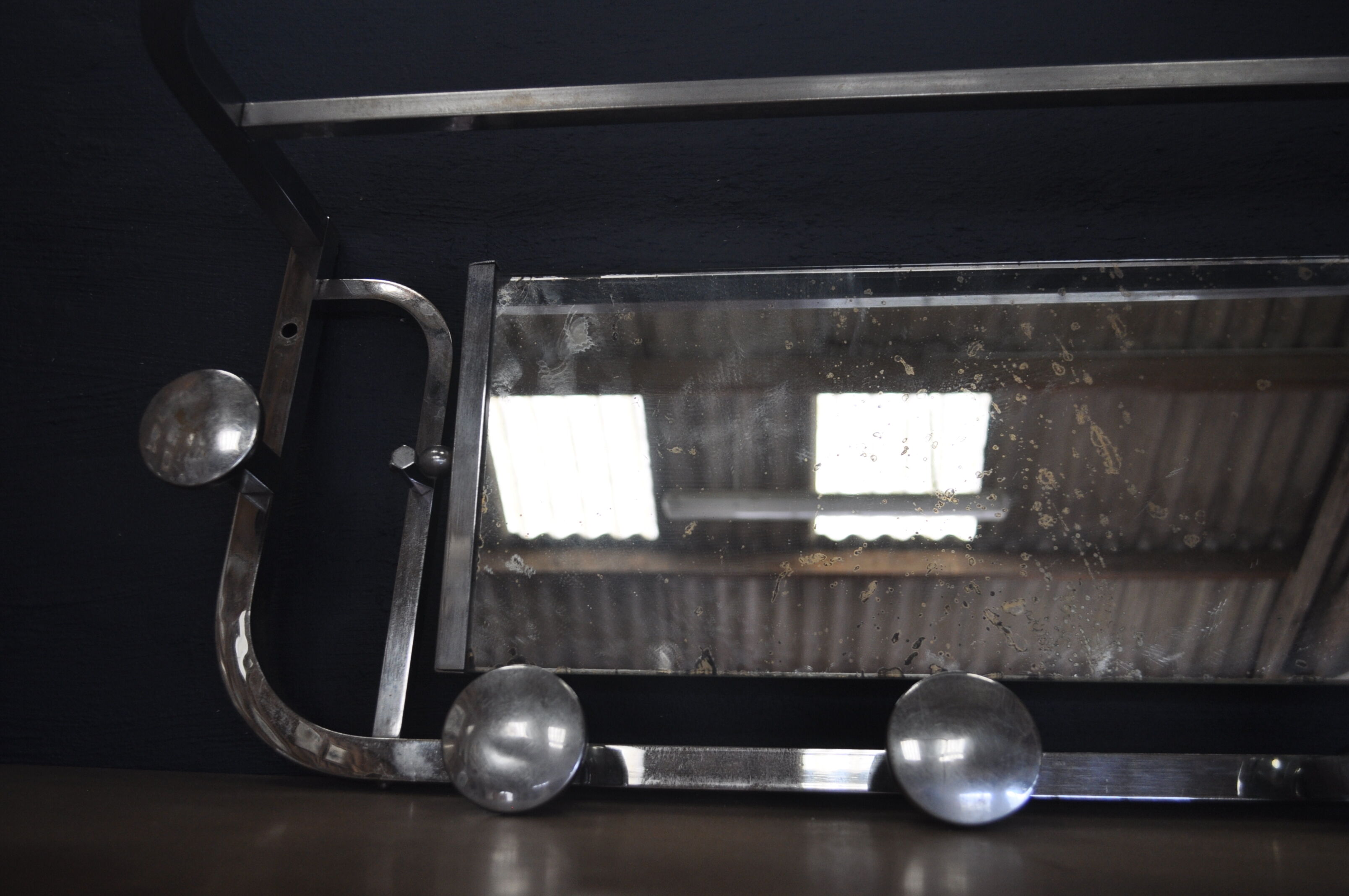 Aluminum wall coat rack.