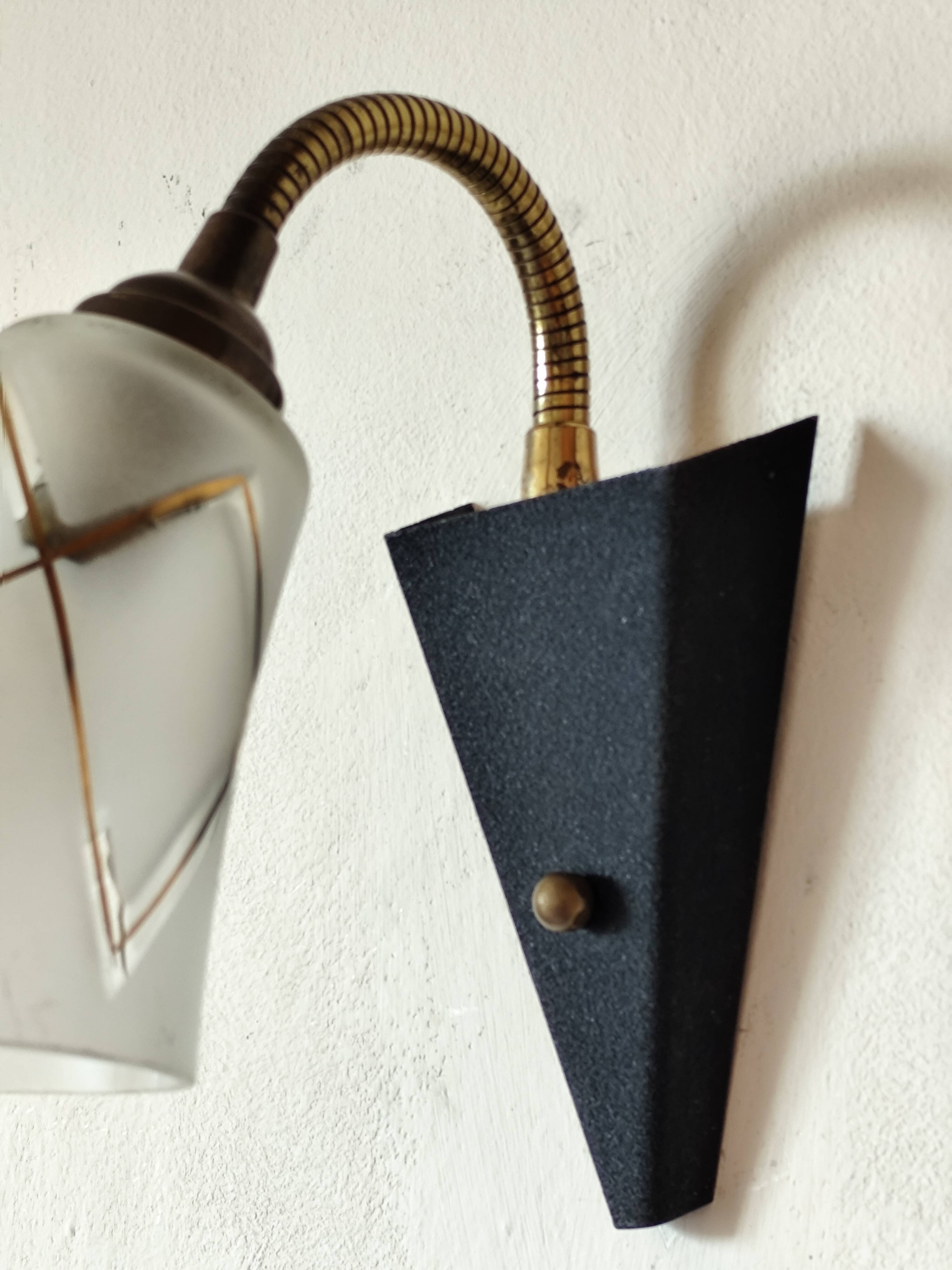 1950s wall lamp, metal, flexible brass stem and opaque shade.