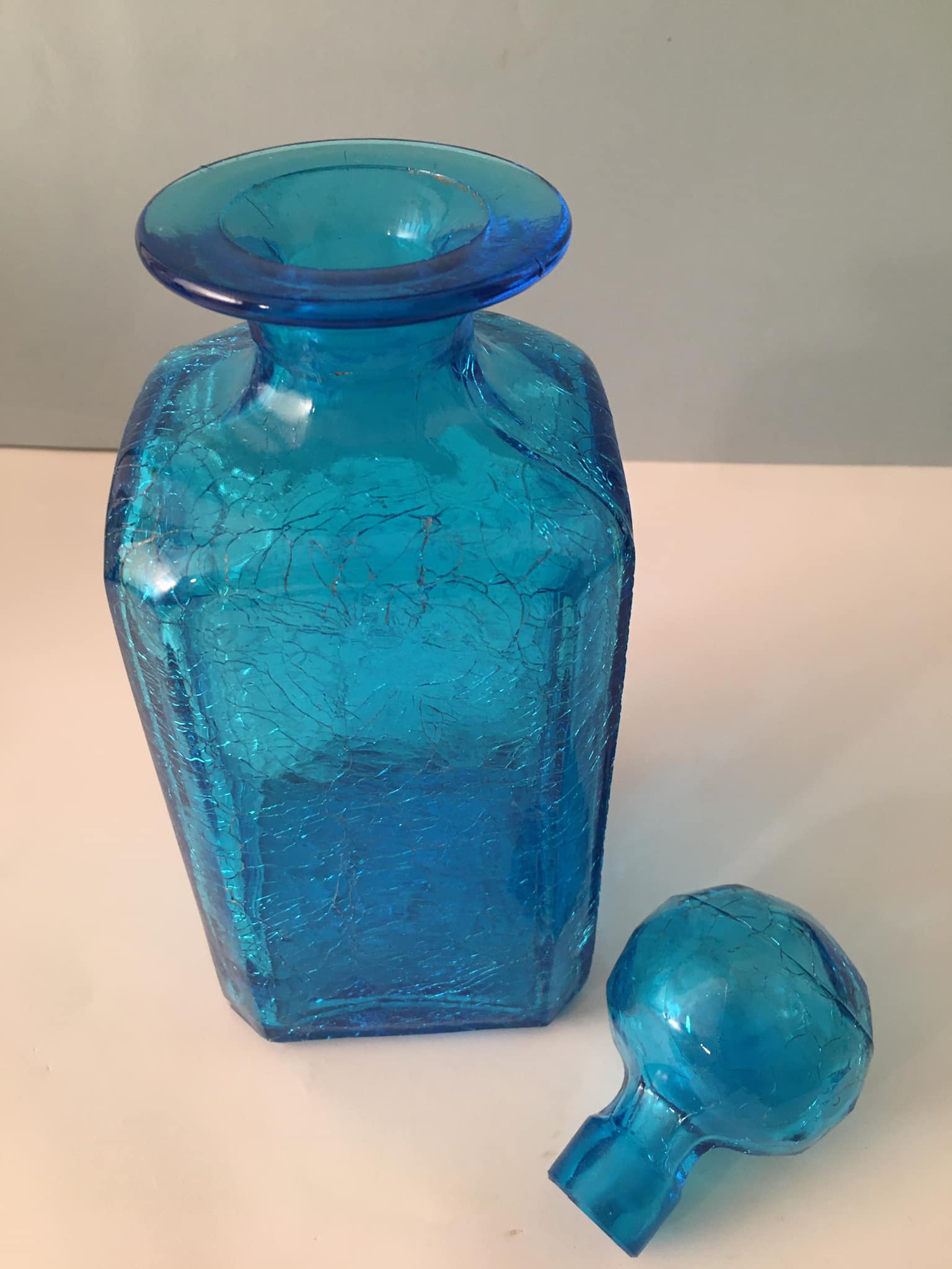 Blue glass bottle with glass cap