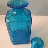 Blue glass bottle with glass cap