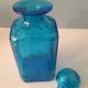 Blue glass bottle with glass cap