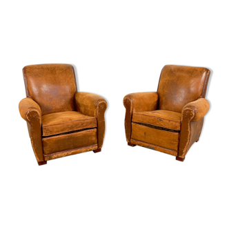 Set of two antique worn sheep leather armchairs Rouen