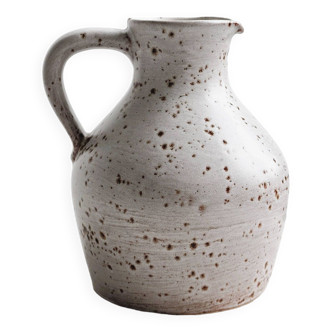 Pitcher, jar, jug in spotted stoneware.