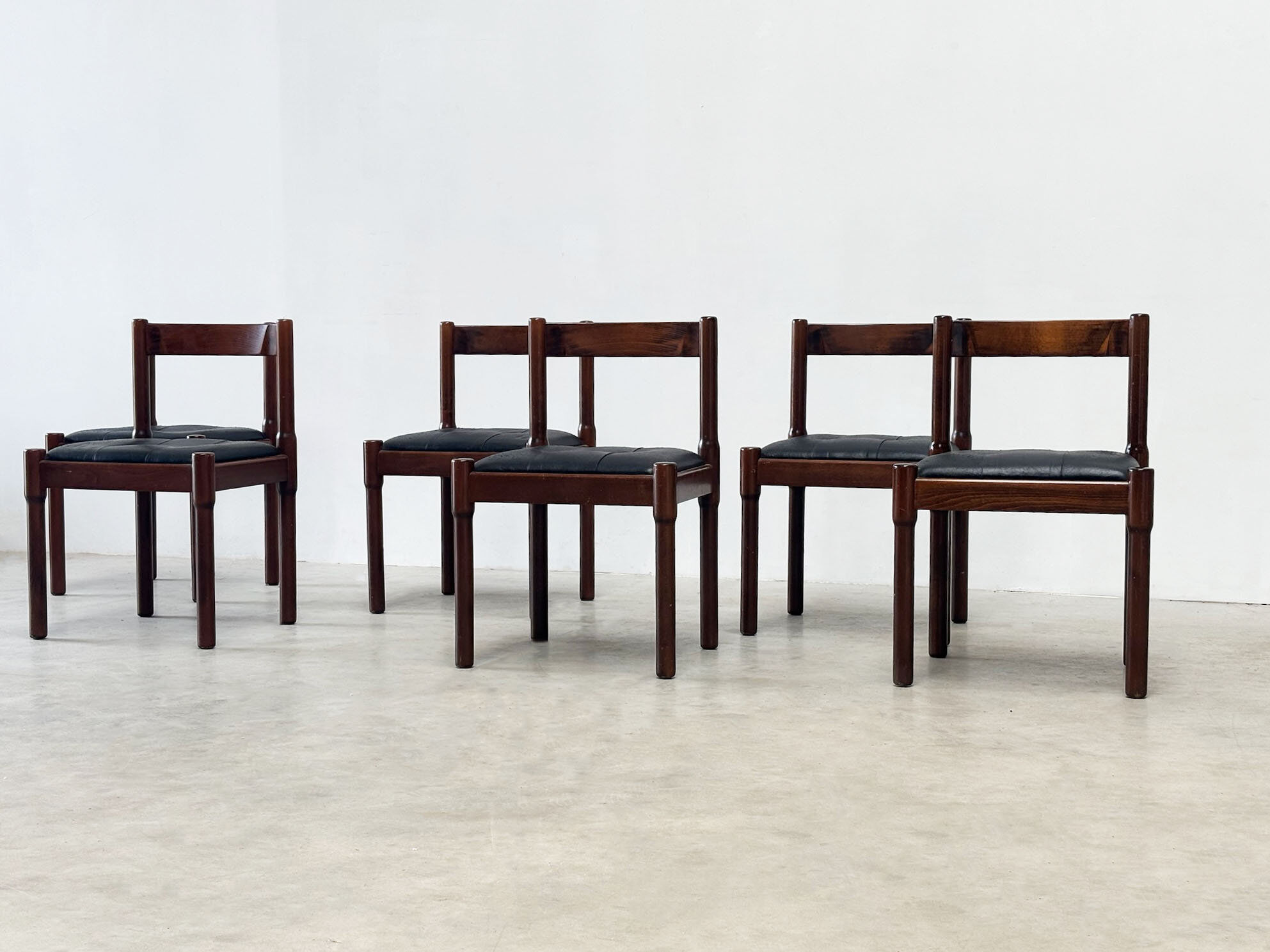Set of six leather "Carimate" dining chairs by Vico Magistretti for Cassina