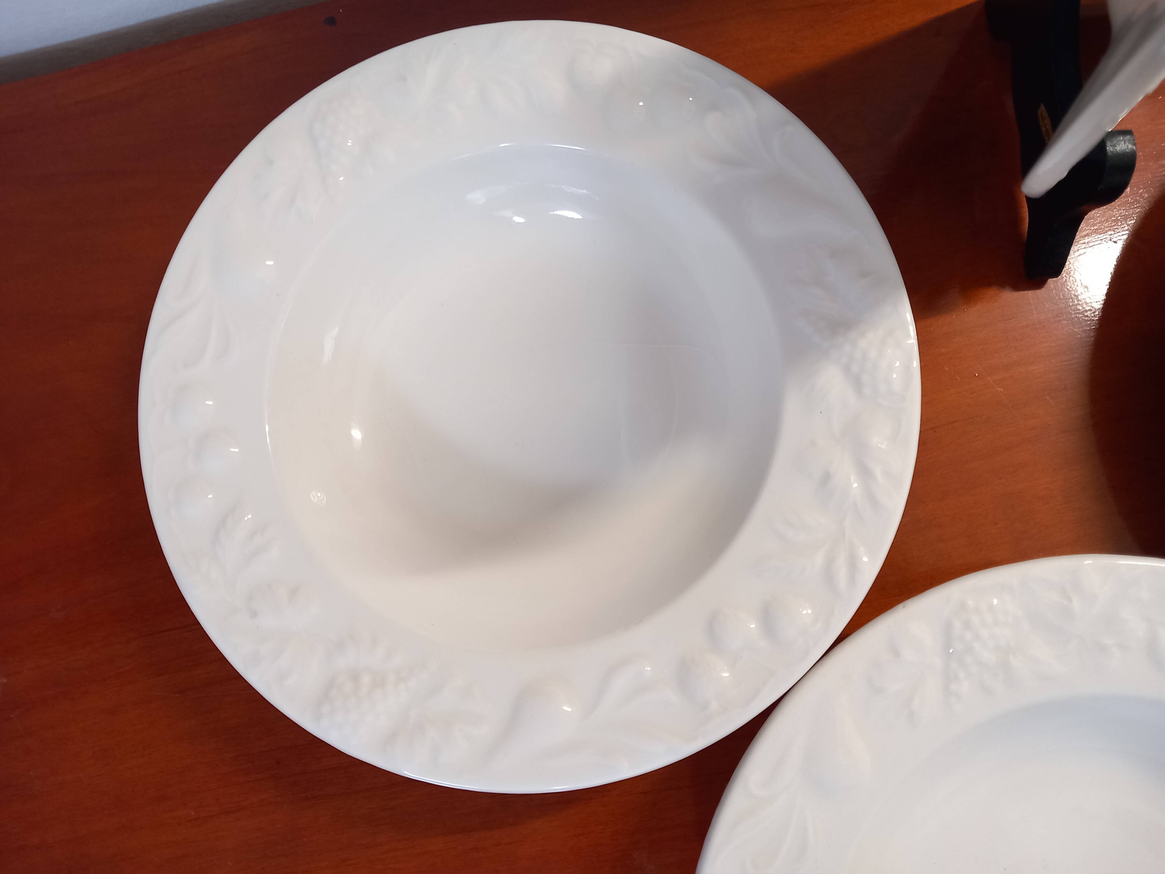 Set of 6 white ceramic deep plates made in Italy.