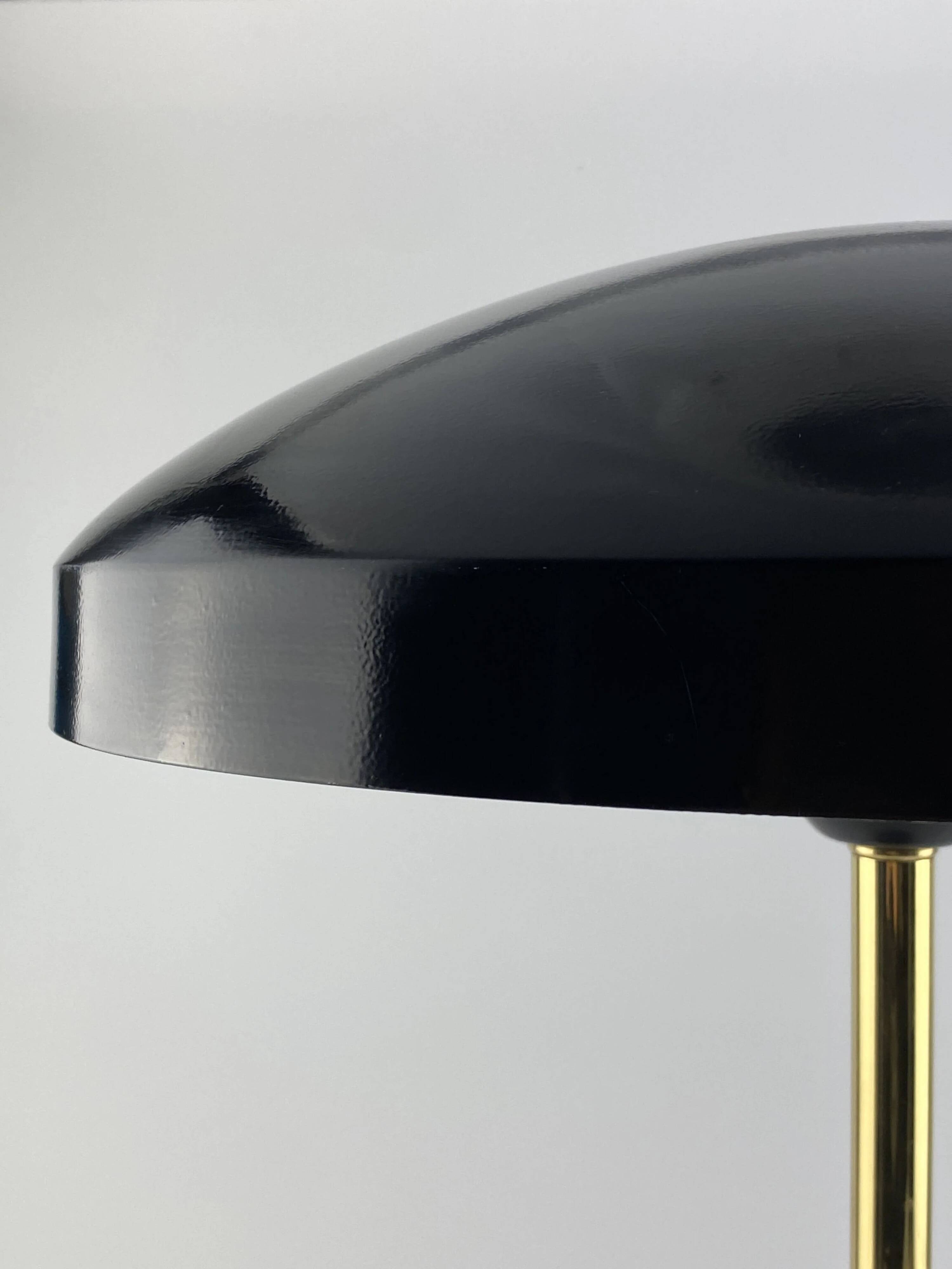 Rare black and gold UFO table lamp by Louis Kalff for Philips.