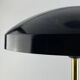 Rare black and gold UFO table lamp by Louis Kalff for Philips.