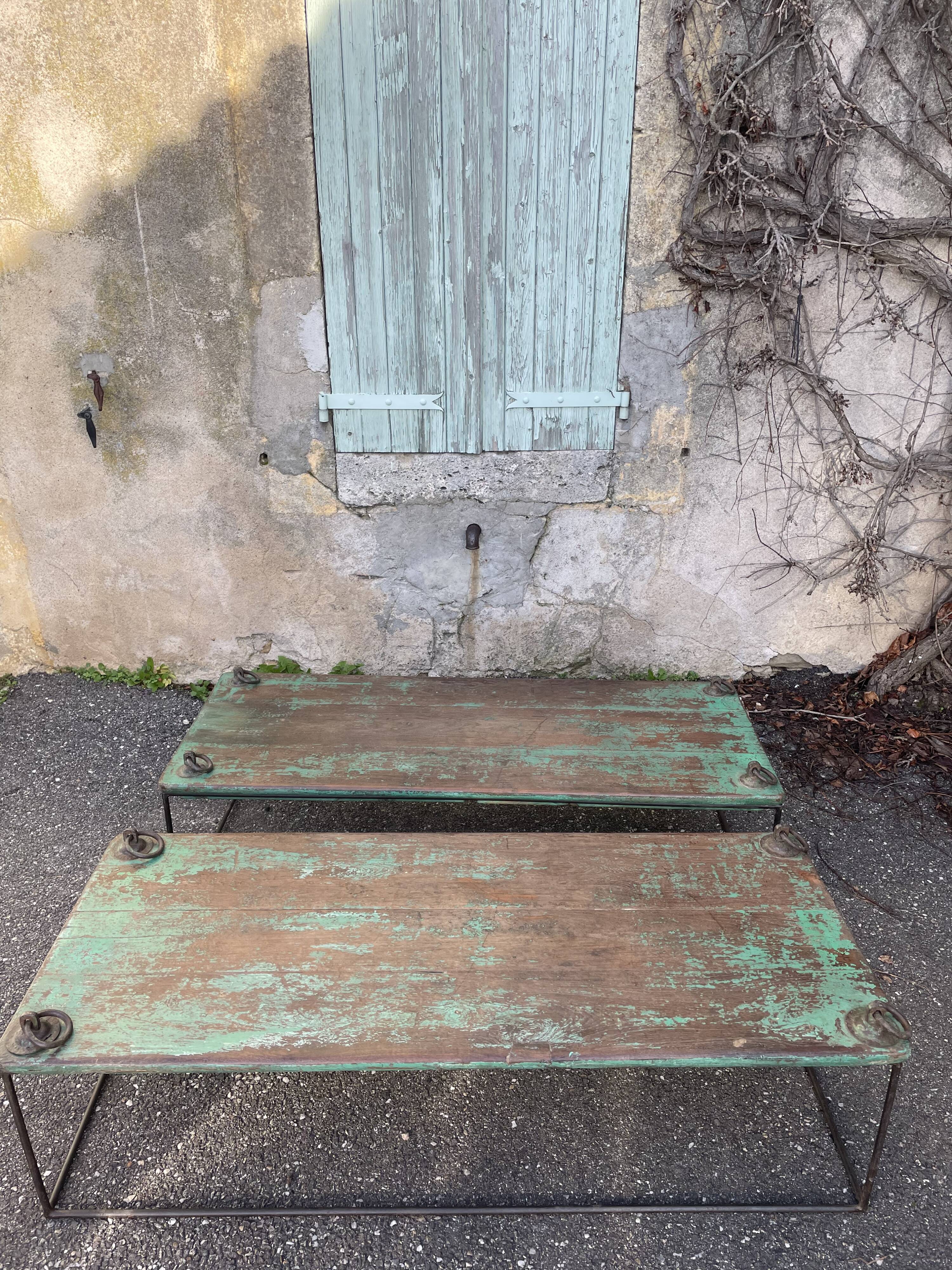 Pair of green teak coffee tables.