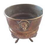 Hammered copper planter cover, lion's head handles and feet