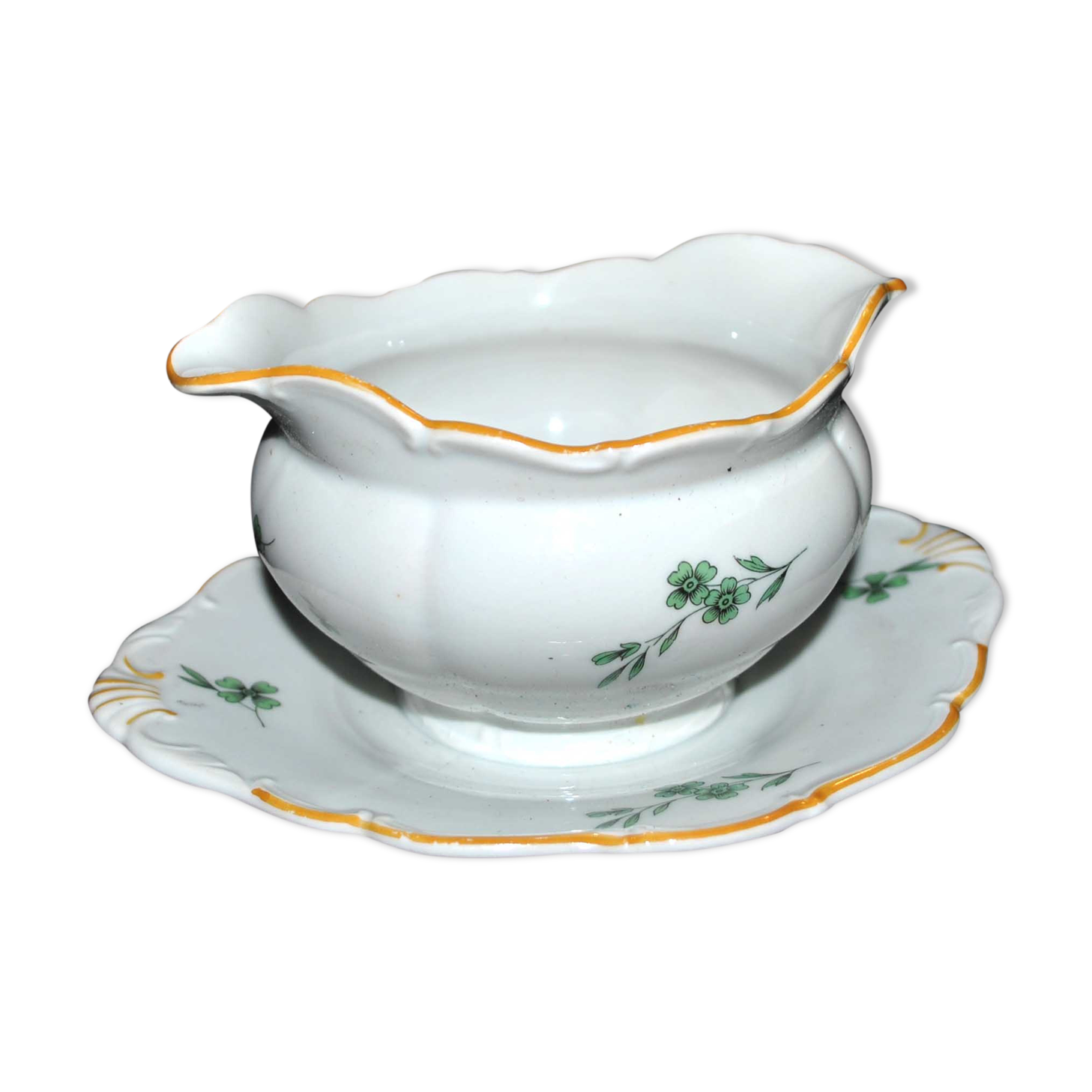 Vintage porcelain pouring saucière decorated with green clover
