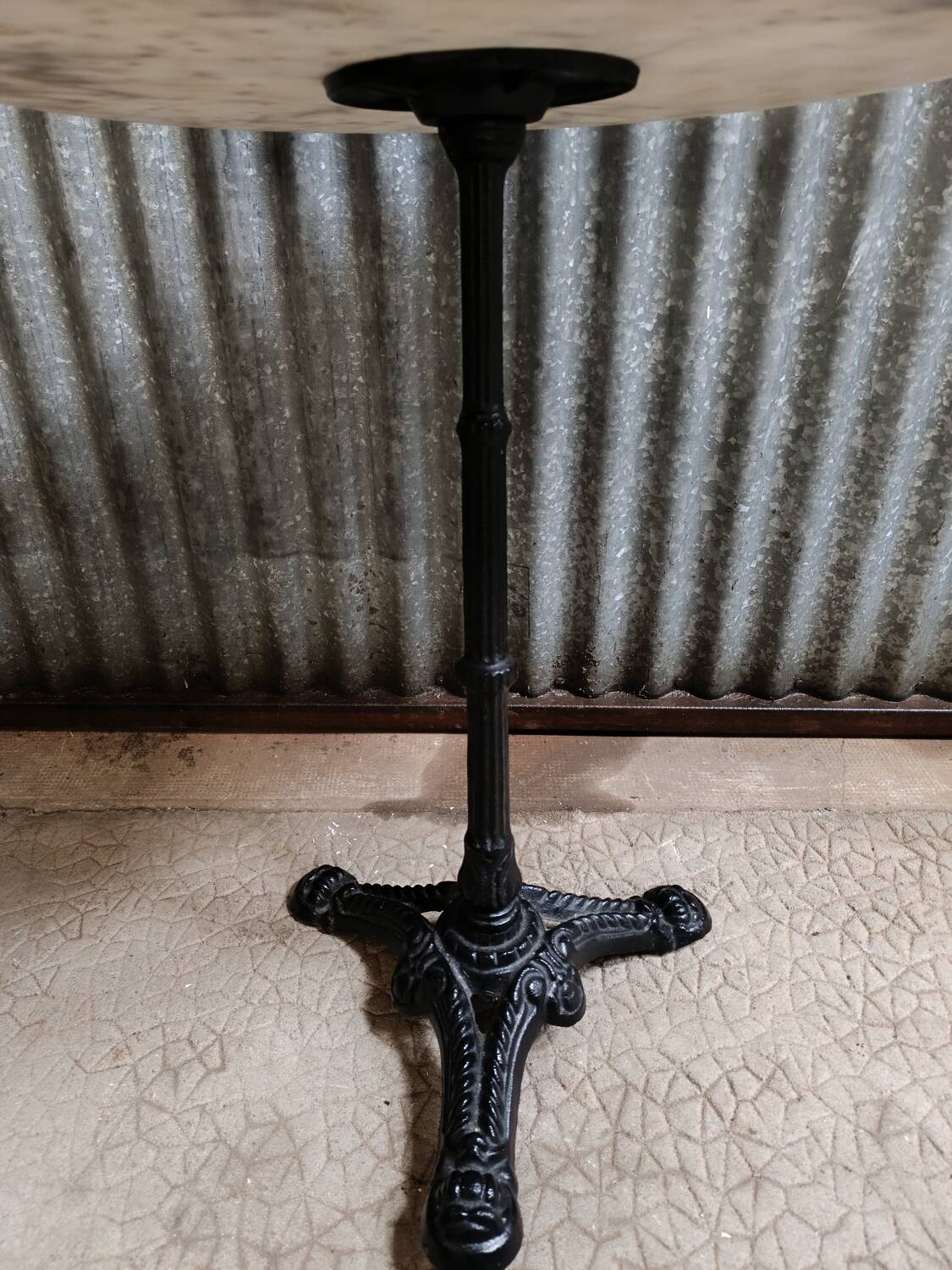 Round marble bistro table with cast iron legs