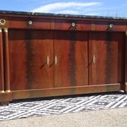Flamed mahogany enfilade with sea green marble in Empire style.