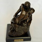 The bronze sculpture The Kiss, a reproduction of Rodin's statue, French sculpture.