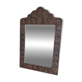Ancient oriental mirror in embossed copper