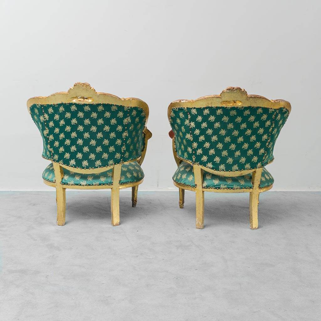 Pair of Louis XV style gilded armchairs with vintage green fabric