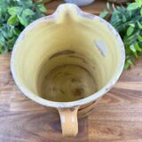 Large vintage ceramic pitcher with abstract green and brown decoration.