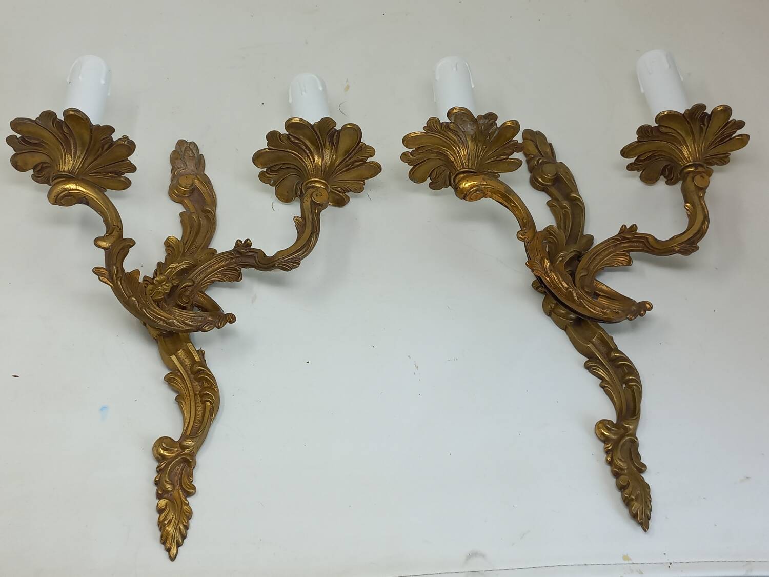 Pair of Louis XV style two-light bronze wall sconces
