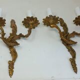 Pair of Louis XV style two-light bronze wall sconces