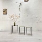Suite of metal and glass nesting tables.