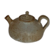 Vintage teapot in reeds