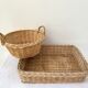 Duo of baskets in braided rattan