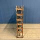 Old wooden workshop shelf with cast iron wheels.