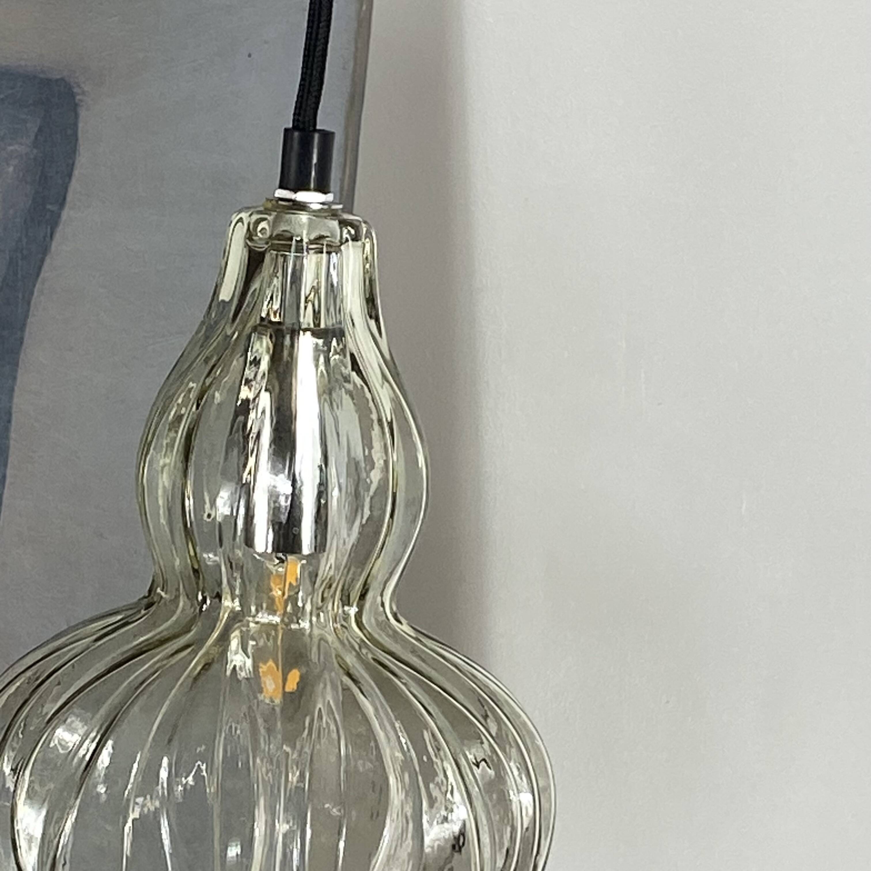 Pair of vintage glass pendant lights.