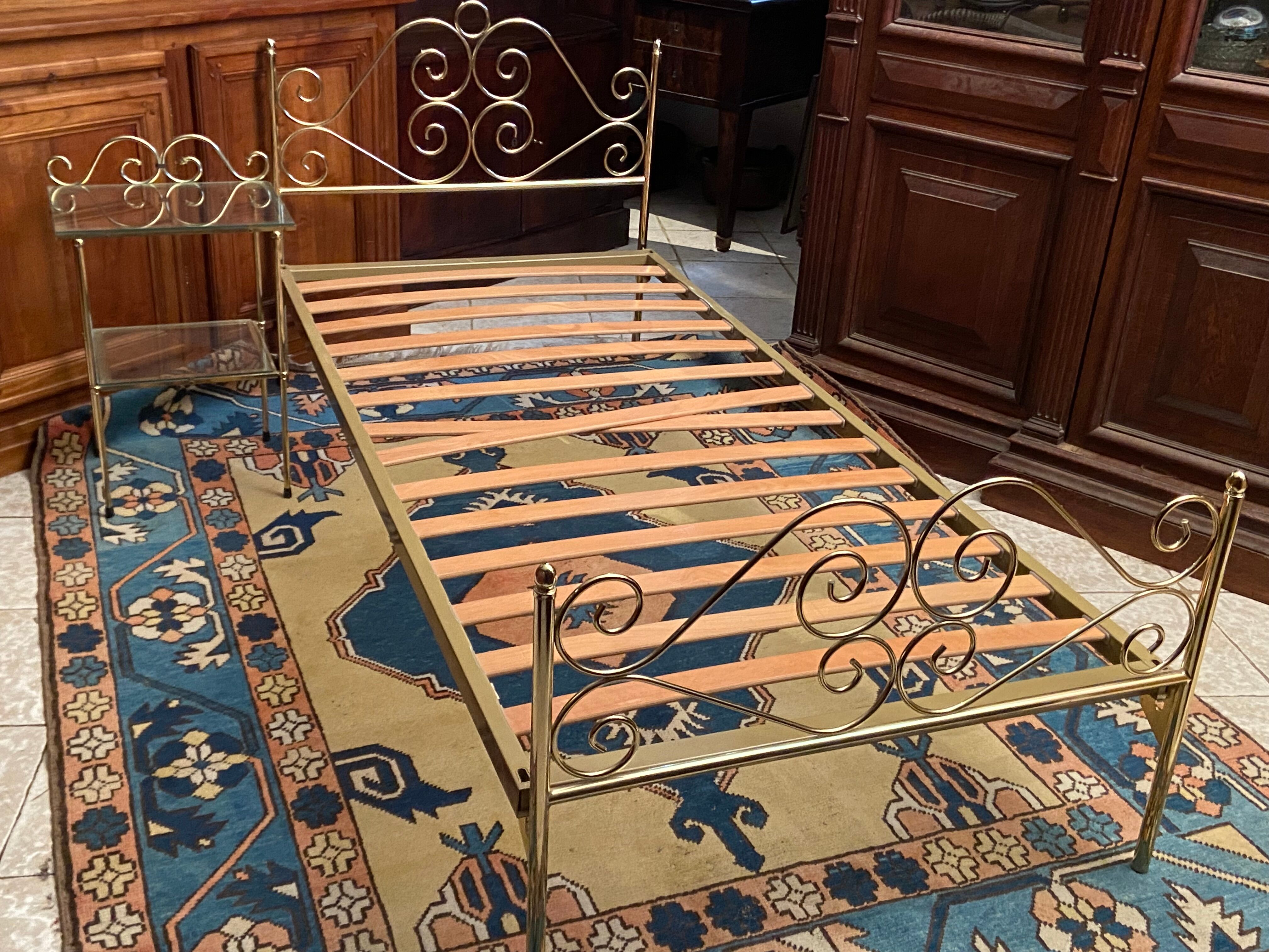 Romantic style single bed in brass with bedside table