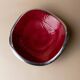 Red enameled steel bowl with textured interior and silver exterior; vintage Italian 1970s design