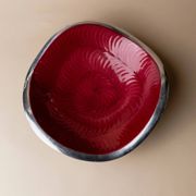 Red enameled steel bowl with textured interior and silver exterior; vintage Italian 1970s design