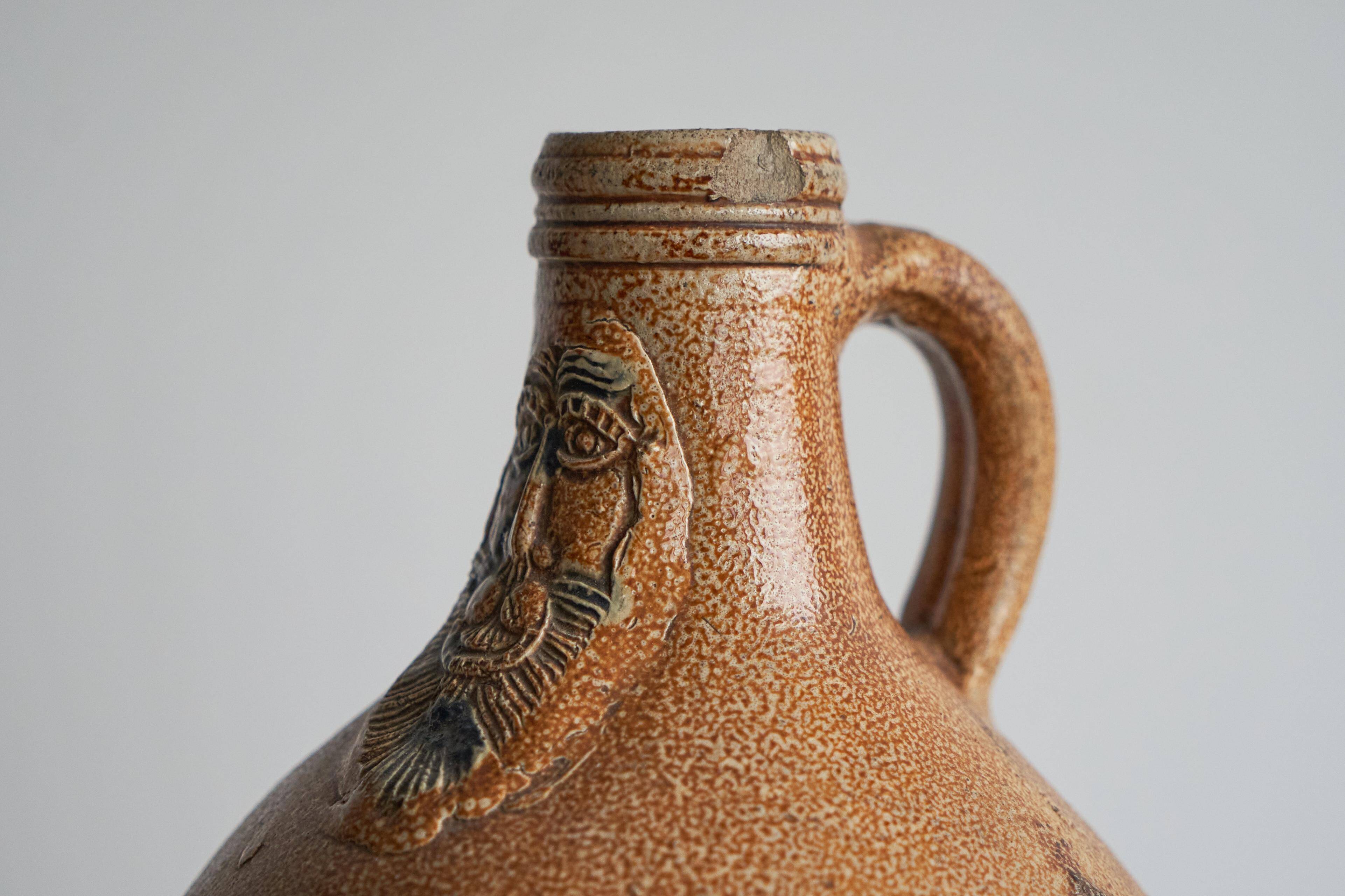 Bartmann jug / Bellarmine 17th century in salt-glazed stoneware