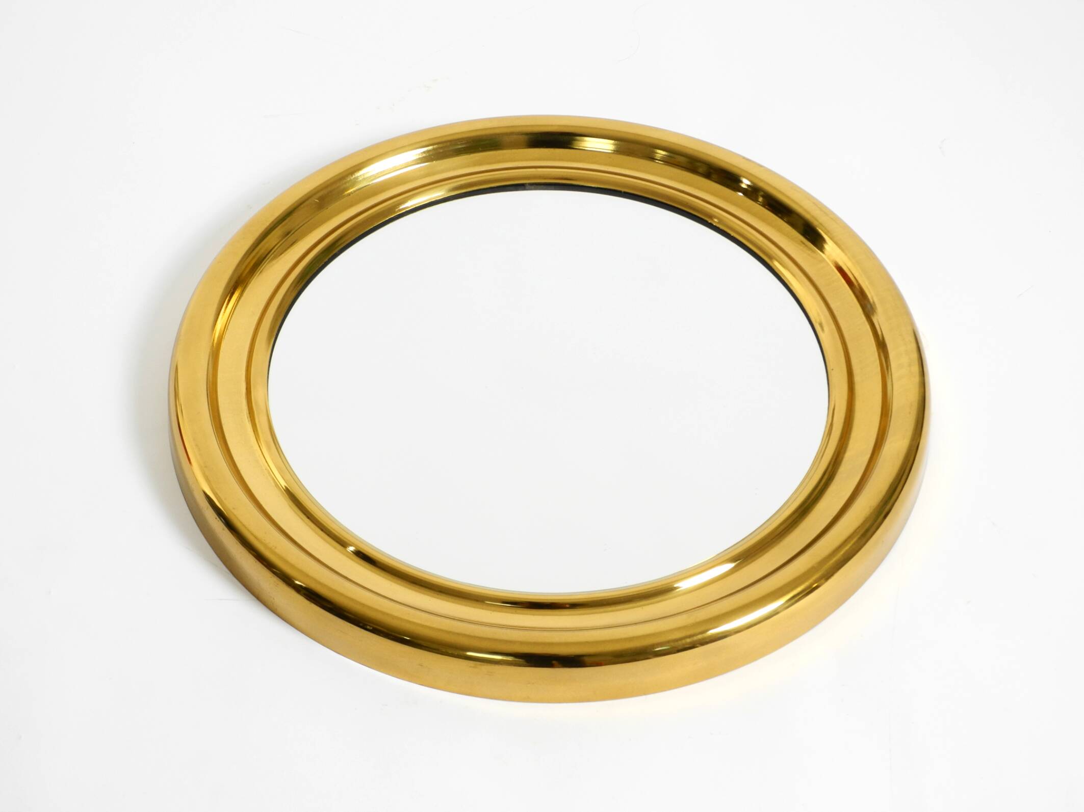 Beautiful, heavy, round Italian brass mirror from the 1960s