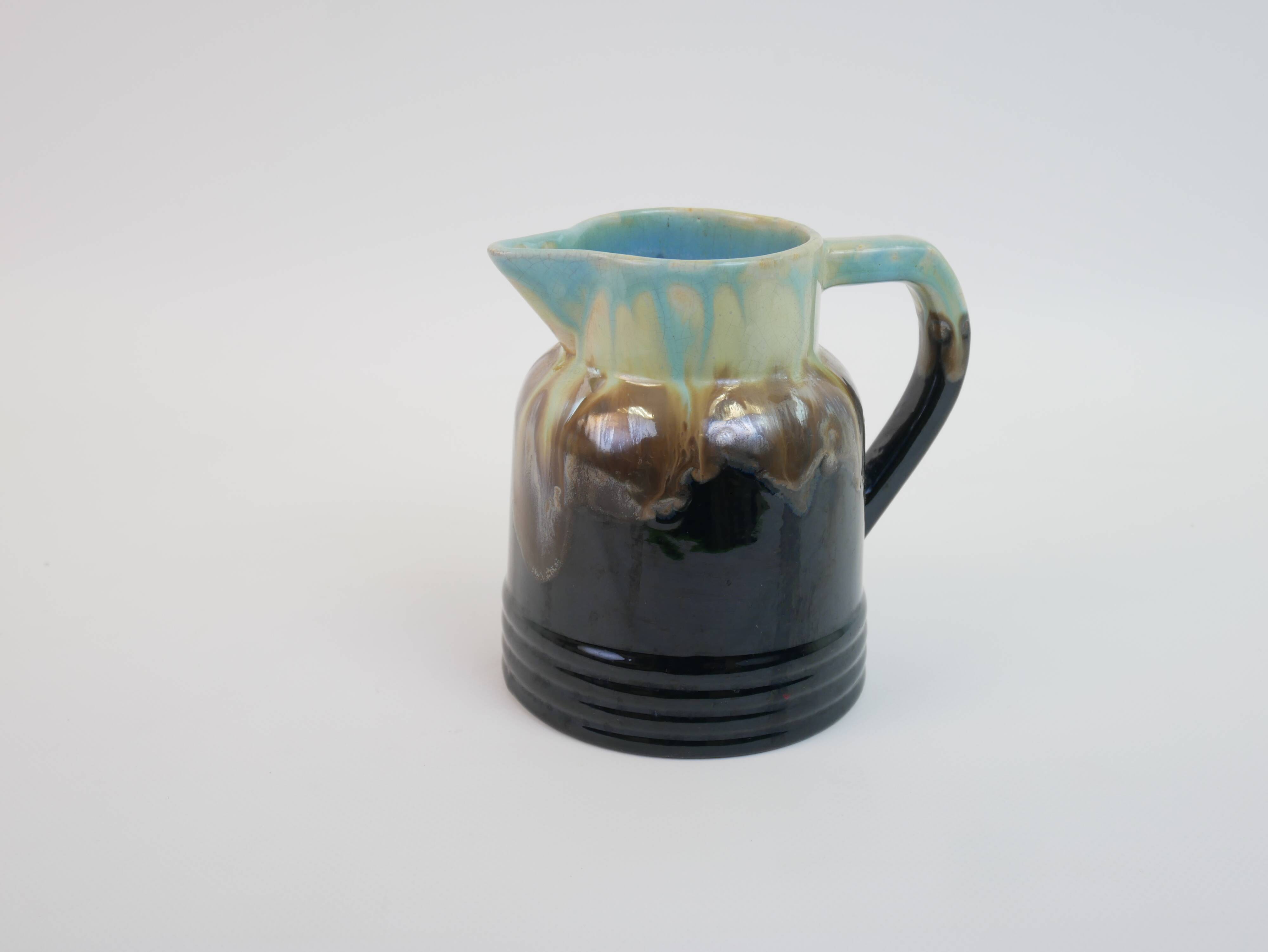 Art Deco pitcher in black, brown and blue glazed ceramic