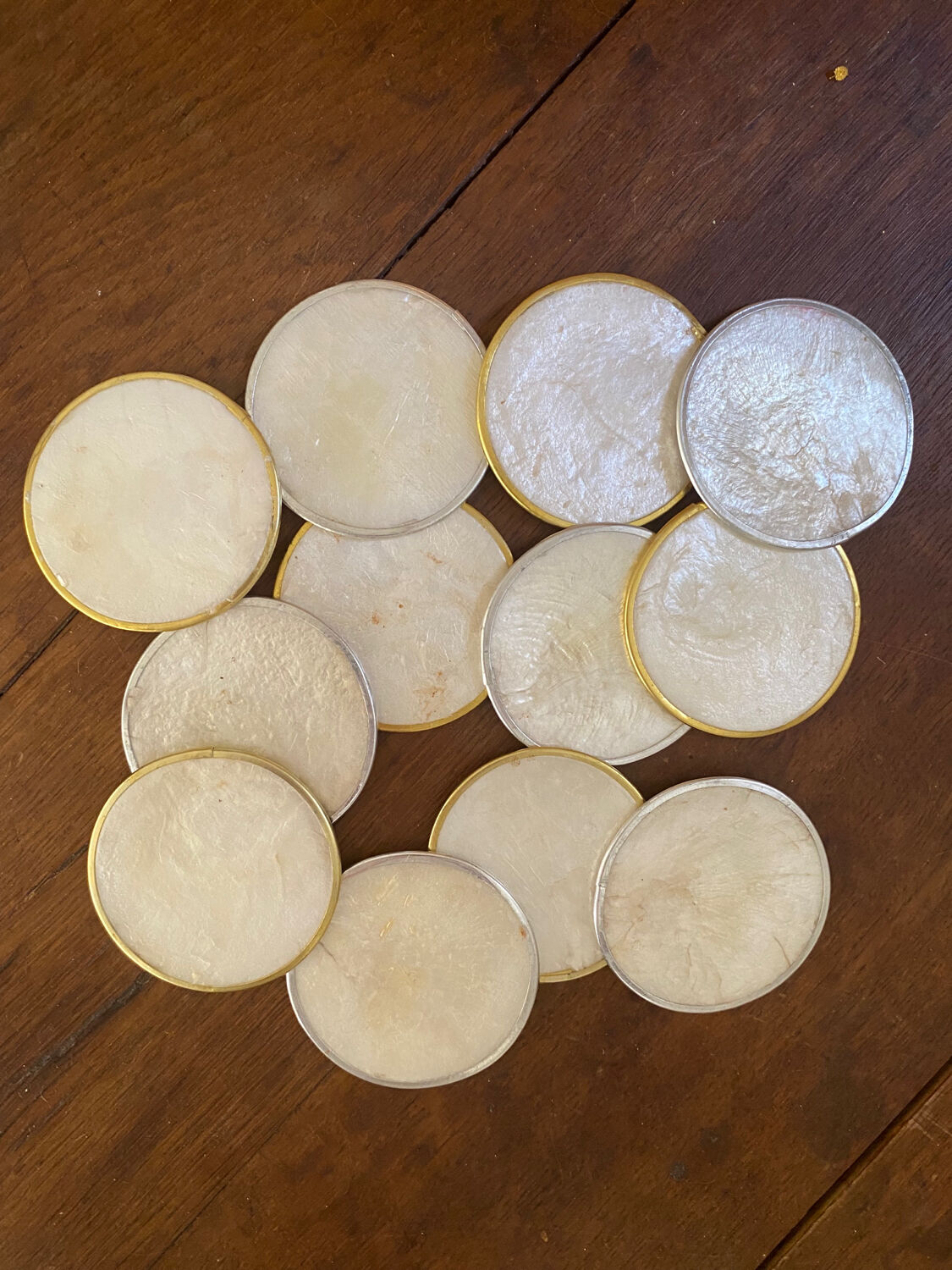 Set of 12 coasters in mother-of-pearl and gilded metal