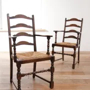 Pair of English oak armchairs with ladder back and rush seats