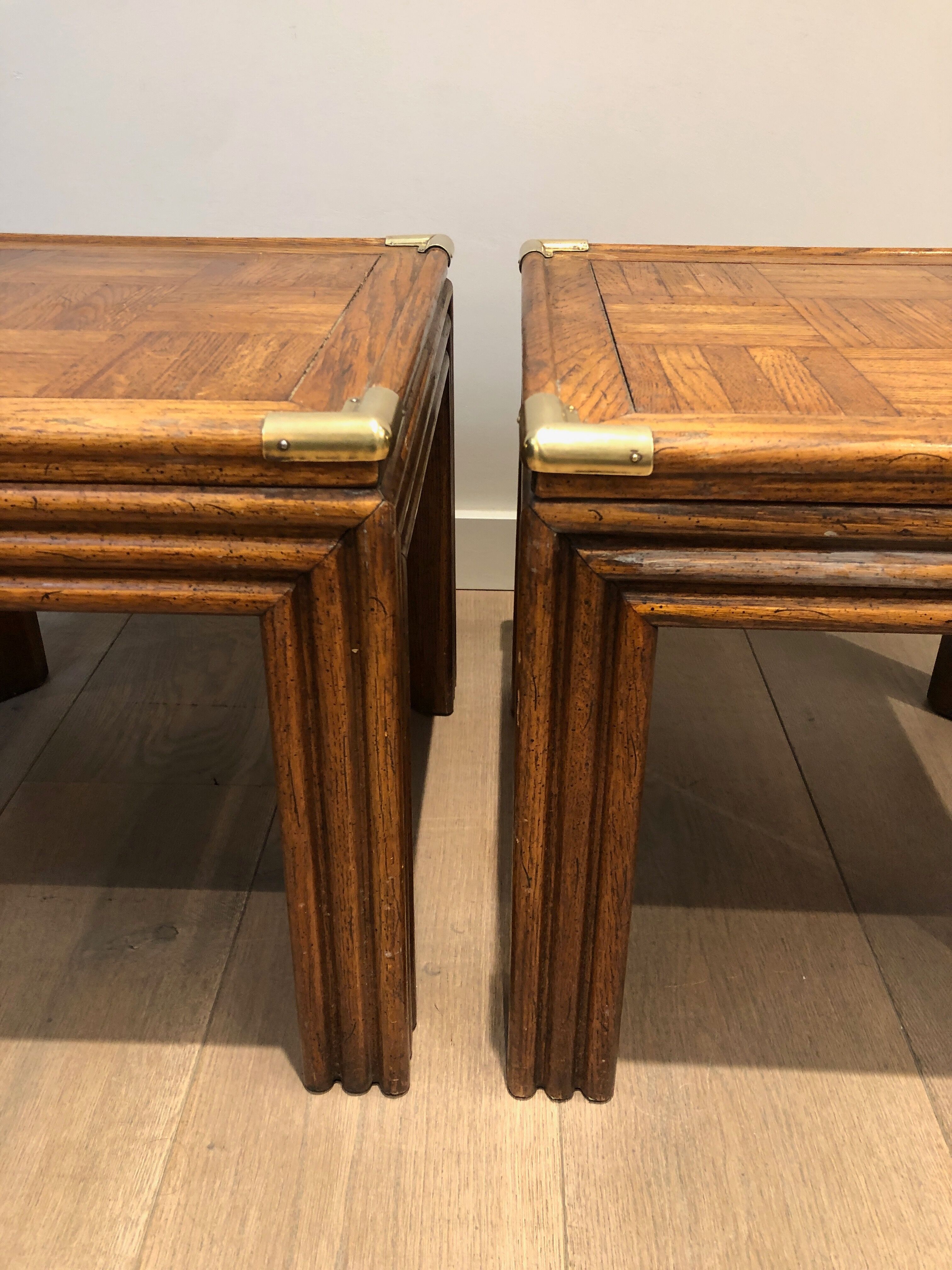 Pair of wooden and brass sofa ends