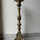 Gilded bronze candlestick with cherub trio decoration