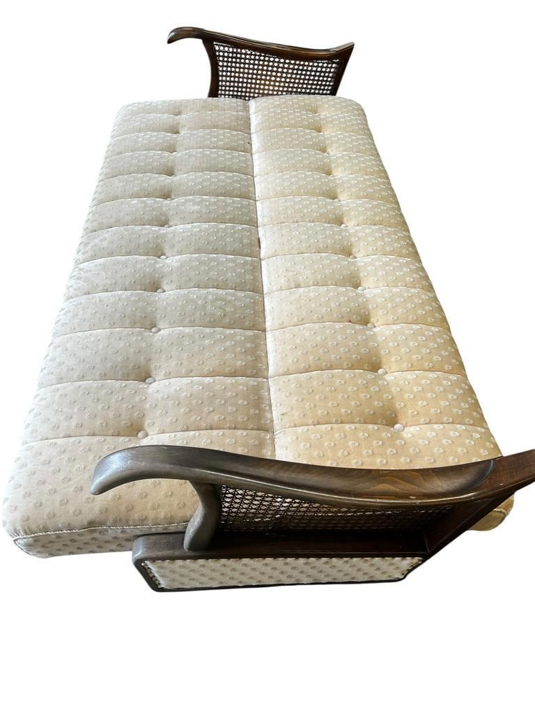 Vintage wooden armchair with rattan weaving.