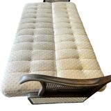 Vintage wooden armchair with rattan weaving.