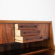 Rosewood chest of drawers with 2 drawers, forming a secretary. 1970s.