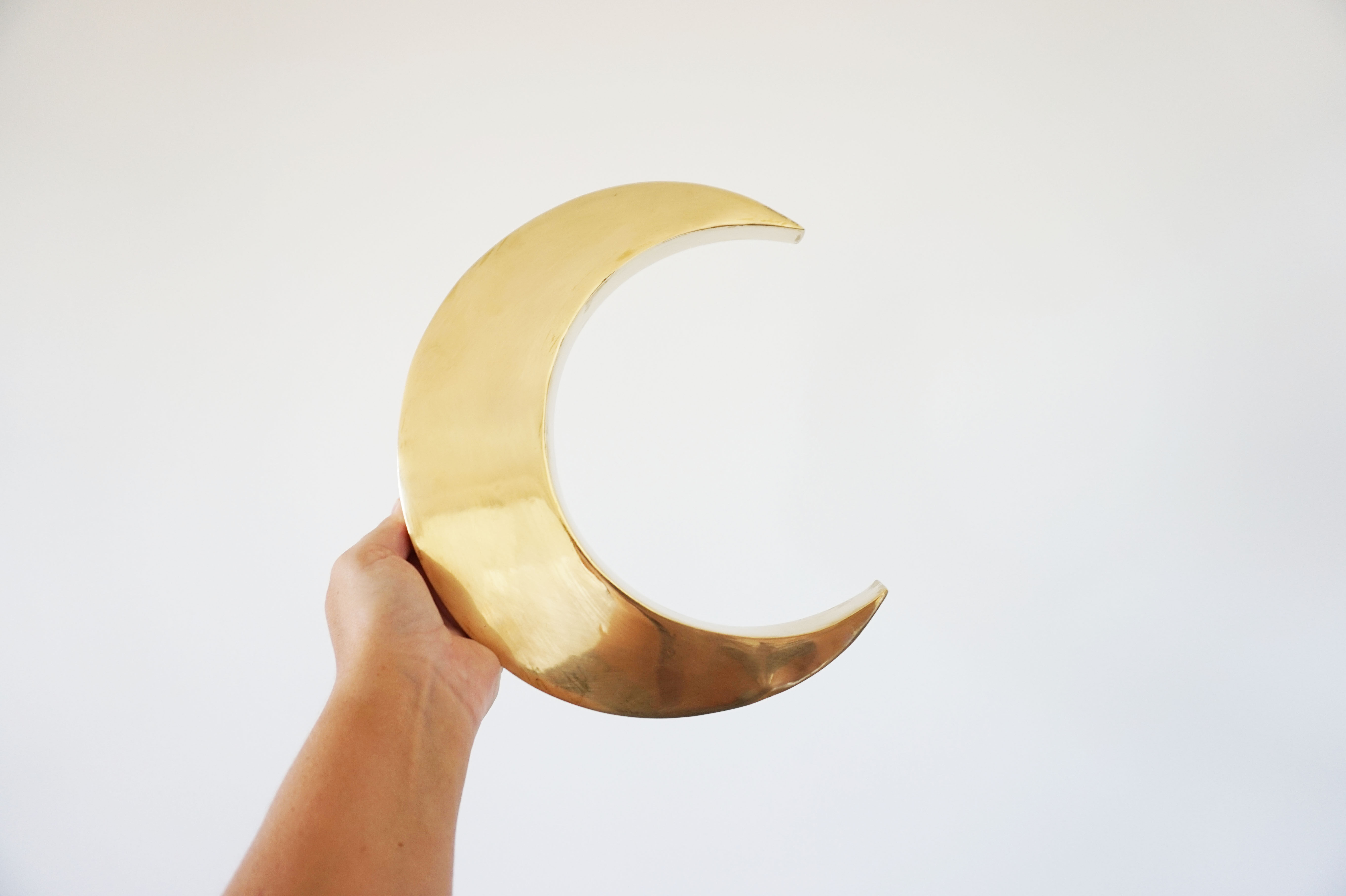 Moon or letter of sign "C" in vintage brass